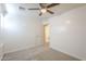 Neutral bedroom shows a door to the bathroom, neutral carpet, and bright white walls at 854 S San Marcos Bldg 6 -- # A, Apache Junction, AZ 85120