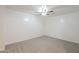 This is a comfortable bedroom featuring plush carpeting and a modern ceiling fan at 854 S San Marcos Bldg 6 -- # A, Apache Junction, AZ 85120