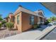 A lovely desert home featuring neutral color scheme, low maintenance landscaping and sidewalk at 854 S San Marcos Bldg 6 -- # A, Apache Junction, AZ 85120
