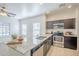Kitchen island features stainless steel sink and granite countertop at 854 S San Marcos Bldg 6 -- # A, Apache Junction, AZ 85120
