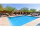 Community pool surrounded by desert landscaping and residential buildings at 854 S San Marcos Bldg 6 -- # A, Apache Junction, AZ 85120