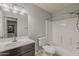 A functional bathroom featuring a vanity with a dark wood finish, a toilet, and a shower-tub combination at 854 S San Marcos Dr Bldg 6 Dr # D, Apache Junction, AZ 85120