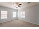 Bright bedroom featuring multiple windows and neutral carpet and paint throughout the room at 854 S San Marcos Dr Bldg 6 Dr # D, Apache Junction, AZ 85120