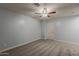 Spacious bedroom with neutral carpeting, a ceiling fan, and fresh paint provides a blank canvas at 854 S San Marcos Dr Bldg 6 Dr # D, Apache Junction, AZ 85120