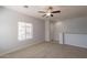 Spacious bedroom featuring a ceiling fan and a bright window with neighborhood views at 854 S San Marcos Dr Bldg 6 Dr # D, Apache Junction, AZ 85120