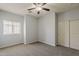 Bedroom featuring plush carpet, a large closet, and a bright window at 854 S San Marcos Dr Bldg 6 Dr # D, Apache Junction, AZ 85120