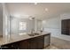 Kitchen featuring granite counters and an island with a stainless steel dishwasher and double sink at 854 S San Marcos Dr Bldg 6 Dr # D, Apache Junction, AZ 85120