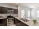 Kitchen featuring stainless steel appliances, granite countertops, and a stainless steel sink at 854 S San Marcos Dr Bldg 6 Dr # D, Apache Junction, AZ 85120