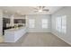 Open-concept living room area with plush carpet and lots of natural light at 854 S San Marcos Dr Bldg 6 Dr # D, Apache Junction, AZ 85120