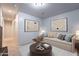 A nicely decorated living room with a modern couch, stylish decor, and beautiful artwork provides an inviting living space at 854 S San Marcos Dr Bldg 6 Dr # D, Apache Junction, AZ 85120