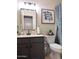 Chic bathroom with modern fixtures, neutral colors, and stylish decorative accents at 8673 W Palm Ln, Phoenix, AZ 85037