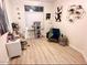 Cozy bedroom with a desk, cat tree, and chair; perfect for work or relaxation at 8673 W Palm Ln, Phoenix, AZ 85037