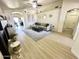 Spacious living area with light wood floors, modern furniture, and stylish decor at 8673 W Palm Ln, Phoenix, AZ 85037