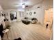 Cozy living room featuring modern decor, wood floors, and a comfortable sofa at 8673 W Palm Ln, Phoenix, AZ 85037
