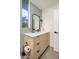 Bathroom with a sleek vanity, modern fixtures and a geometric backsplash at 1111 W University Dr # 1017, Tempe, AZ 85281