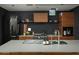 Well-equipped kitchen with a large island, custom cabinetry, and modern appliances at 1111 W University Dr # 1017, Tempe, AZ 85281