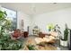 Bright sitting room featuring floor to ceiling windows, stylish furniture, and decorative plants at 1111 W University Dr # 1017, Tempe, AZ 85281