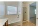 Bright bathroom featuring a bathtub, separate shower and a large window at 1120 W Desert Hollow Dr, San Tan Valley, AZ 85143