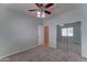 Bedroom featuring neutral walls, carpet, mirrored closet doors and open doorway at 1120 W Desert Hollow Dr, San Tan Valley, AZ 85143