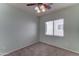 Neutral bedroom with a window, carpet flooring and ample space at 1120 W Desert Hollow Dr, San Tan Valley, AZ 85143