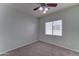 Bedroom featuring a window, carpet flooring, ceiling fan and neutral walls at 1120 W Desert Hollow Dr, San Tan Valley, AZ 85143
