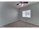 Bedroom featuring a window, carpet flooring, ceiling fan and neutral walls at 1120 W Desert Hollow Dr, San Tan Valley, AZ 85143