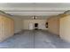Spacious garage with overhead door, ample storage cabinets, and room for multiple cars at 1120 W Desert Hollow Dr, San Tan Valley, AZ 85143