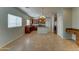 Open kitchen featuring center island, wood cabinetry, granite countertops, and stainless steel appliances at 1120 W Desert Hollow Dr, San Tan Valley, AZ 85143