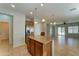 Open kitchen featuring center island, wood cabinetry, granite countertops, and stainless steel appliances at 1120 W Desert Hollow Dr, San Tan Valley, AZ 85143