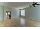 Versatile living room with tile floors, ceiling fan, and seamless transition to other areas is perfect for modern living at 1120 W Desert Hollow Dr, San Tan Valley, AZ 85143