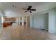 Spacious living room with tile floors, a ceiling fan, and an open layout provides ample space for flexible design options at 1120 W Desert Hollow Dr, San Tan Valley, AZ 85143