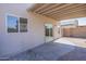 Covered patio leading to a backyard with a block wall fence at 12813 W Paradise Dr, El Mirage, AZ 85335