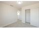 Neutral bedroom with closet and plush carpeting at 12813 W Paradise Dr, El Mirage, AZ 85335