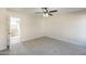 Neutral bedroom featuring a ceiling fan and plush carpeting at 12813 W Paradise Dr, El Mirage, AZ 85335