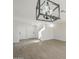 Bright living room featuring vinyl wood floors, neutral walls, white trim, chandelier, and staircase access at 12813 W Paradise Dr, El Mirage, AZ 85335