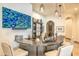 Custom bar area with unique lighting, marble countertop, television, and seating at 13074 E Saddlehorn Trl, Scottsdale, AZ 85259