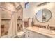 An elegantly designed bathroom with stylish tile work, a vanity, and an enclosed shower at 13074 E Saddlehorn Trl, Scottsdale, AZ 85259