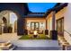 Cozy outdoor courtyard with a fire pit, comfortable seating, and stone accents at 13074 E Saddlehorn Trl, Scottsdale, AZ 85259