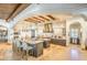 Gourmet kitchen with dual islands, counter seating, wooden beams, high-end appliances, and custom cabinetry at 13074 E Saddlehorn Trl, Scottsdale, AZ 85259