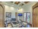 Home office features custom woodwork, built-in shelving, and French doors leading to outdoor area at 13074 E Saddlehorn Trl, Scottsdale, AZ 85259