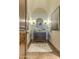 Stylish powder room features a vessel sink, decorative mirror and lighting, and a plush rug at 13074 E Saddlehorn Trl, Scottsdale, AZ 85259