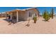 Covered patio provides a comfortable outdoor living space in the low-maintenance backyard at 1362 E Cherry Hills Dr, Chandler, AZ 85249
