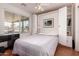 Bedroom featuring Murphy bed, built-in storage, and natural light at 1362 E Cherry Hills Dr, Chandler, AZ 85249