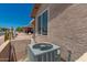 Exterior shot highlighting the AC unit and desert landscaping surrounding the property at 1362 E Cherry Hills Dr, Chandler, AZ 85249