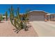 Charming home with a well-maintained desert landscaped front yard and a two-car garage at 1362 E Cherry Hills Dr, Chandler, AZ 85249