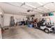 Organized garage space with ample storage, cabinets, and golf cart parking at 1362 E Cherry Hills Dr, Chandler, AZ 85249