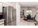 Eat-in kitchen area featuring stainless steel refrigerator and breakfast nook at 1362 E Cherry Hills Dr, Chandler, AZ 85249