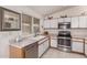 Bright kitchen featuring white cabinets, stainless steel appliances, and a functional layout at 1362 E Cherry Hills Dr, Chandler, AZ 85249