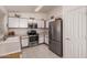 Well-equipped kitchen with stainless steel appliances, ample cabinet space, and bright lighting at 1362 E Cherry Hills Dr, Chandler, AZ 85249