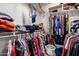 Spacious walk-in closet with built-in shelving provides ample storage and organization options at 1362 E Cherry Hills Dr, Chandler, AZ 85249